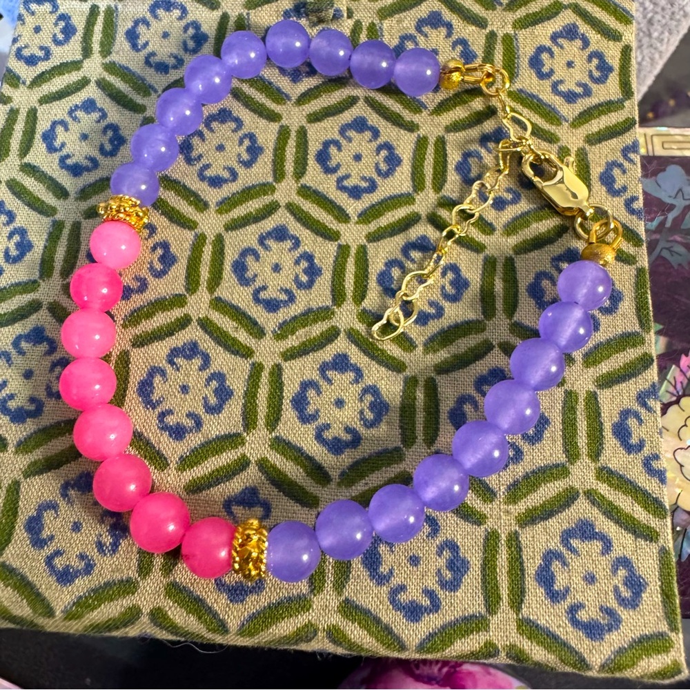 Purple and pink alexandrite bracelet with gold plated accents .  7.5” + 1”
